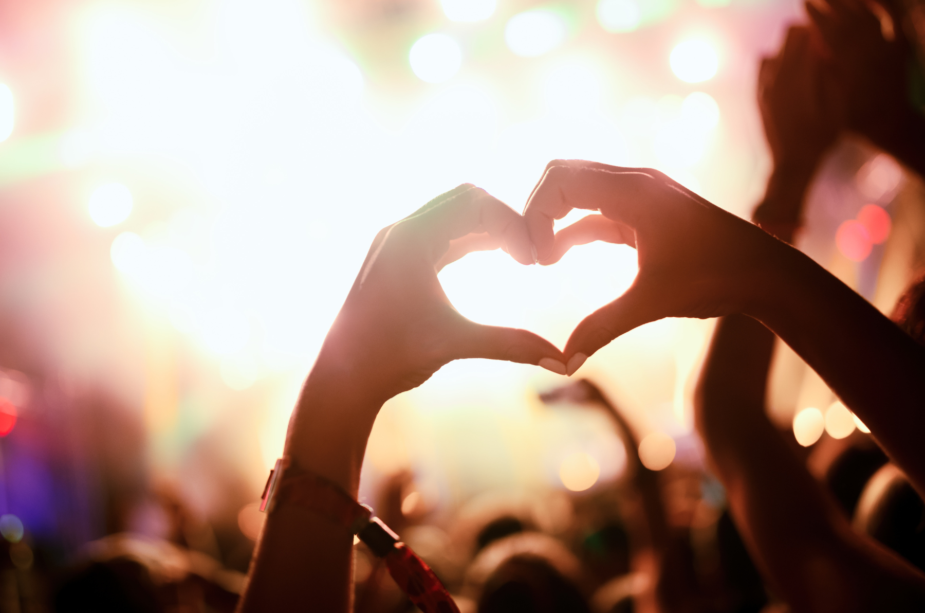 Heart shaped hands in a festival